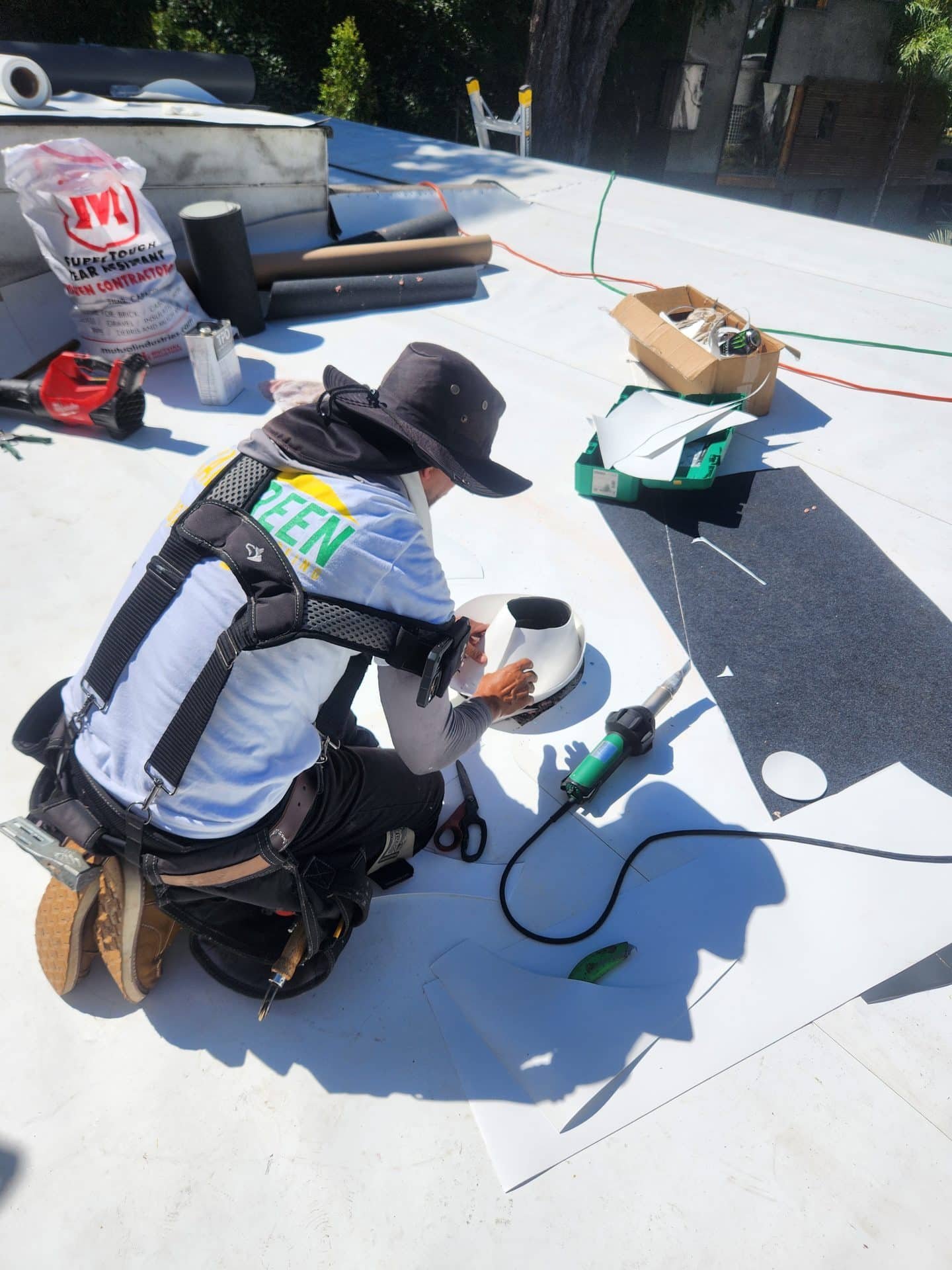 Cal Green Roofing technician heat-welding TPO membrane seams on a flat roof in Los Angeles