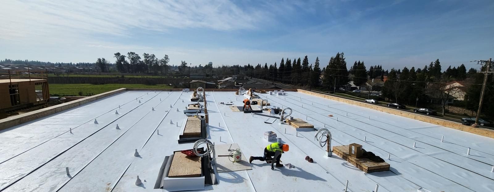 TPO membrane installation on new commercial construction in Southern California