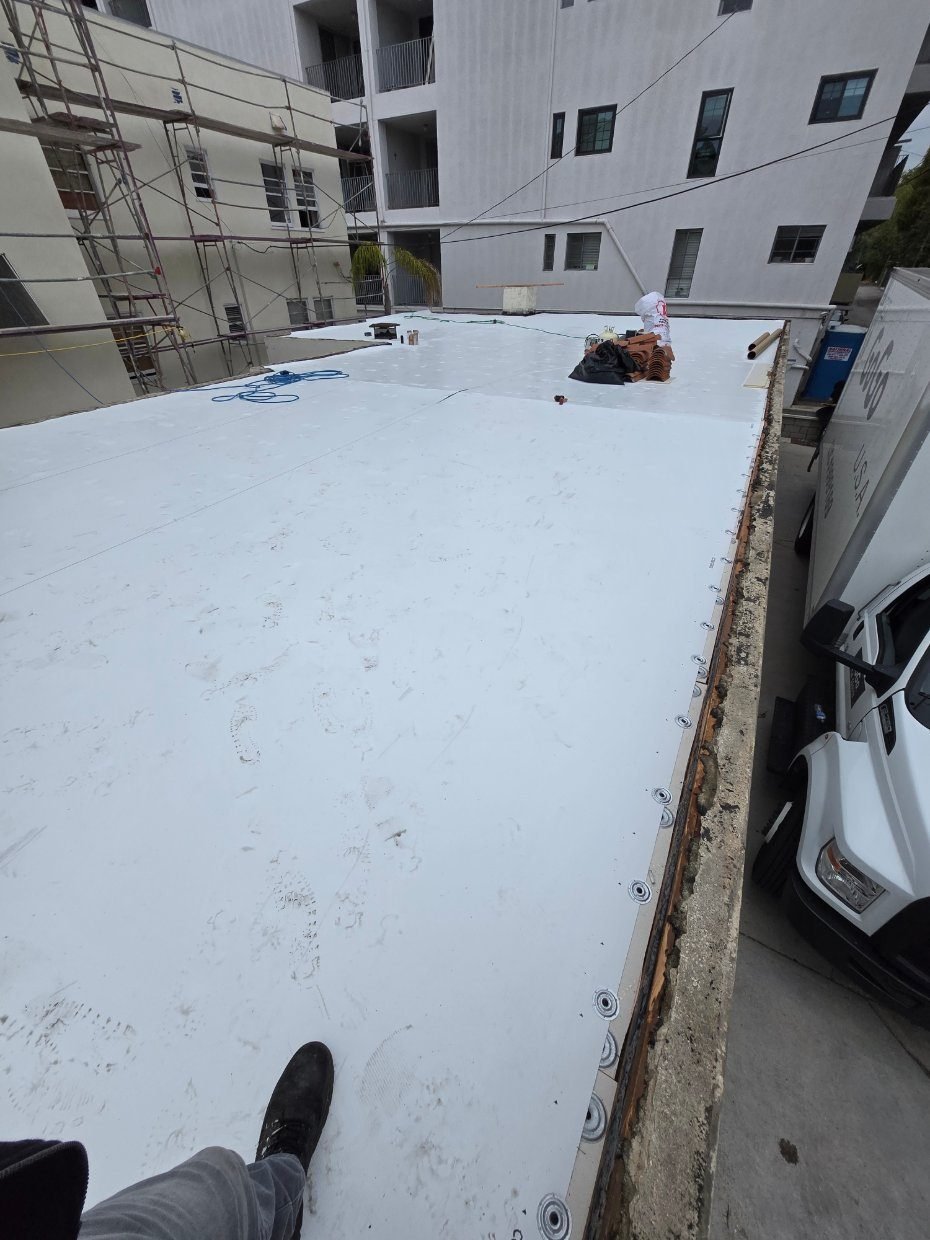 Aerial view of a completed TPO flat roof installed by Cal Green Roofing